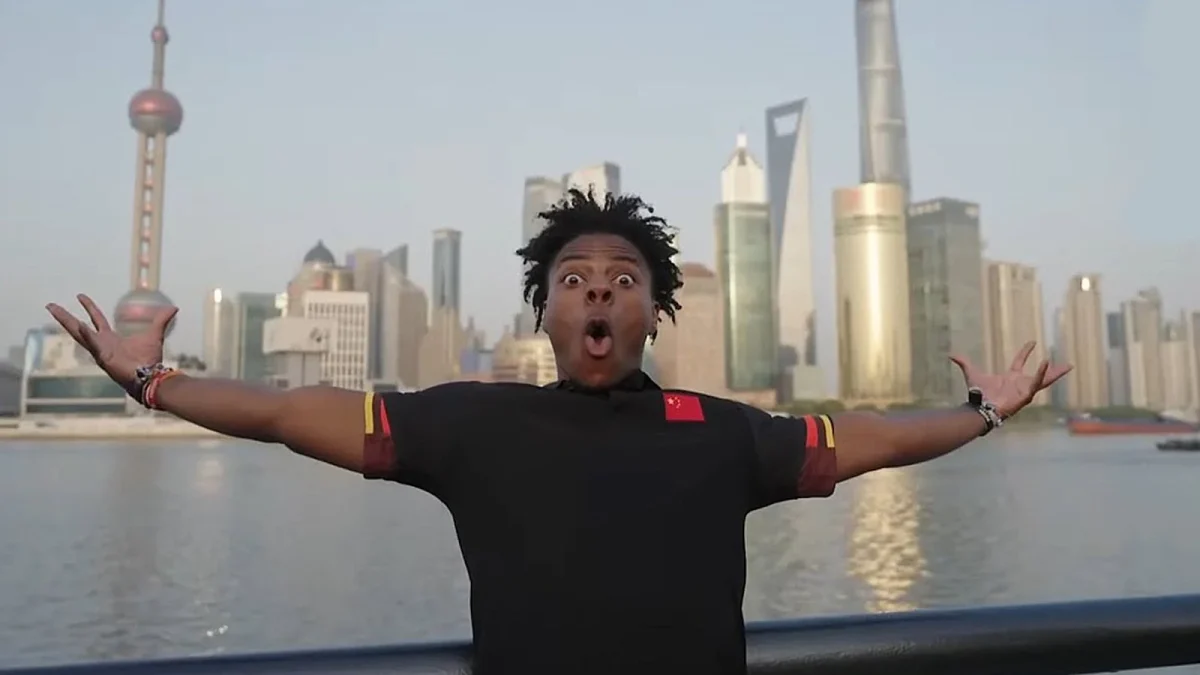 An image from IShowSpeed's recent stream, where he stands with his arms spread in front of the Shanghai skyline. Image credits: South China Morning Post
